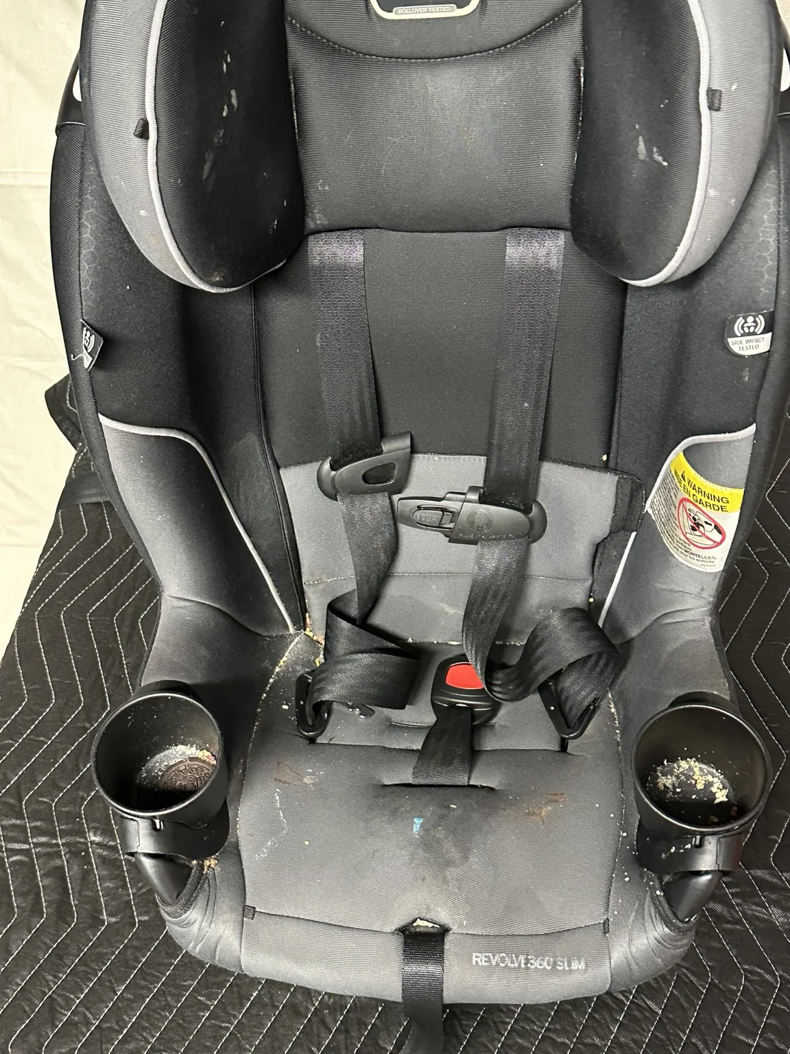 Car seat before WhizSeats cleaning service